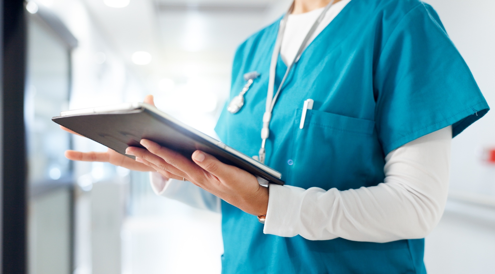 Nursing Lab Initiative — nurse reviewing patient information on a tablet